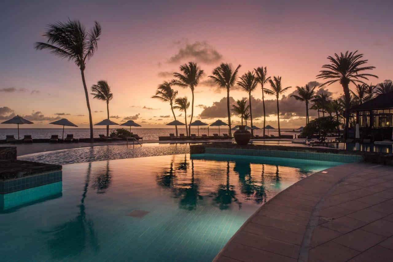 The Residence Mauritius Belle Mare Esterno foto Sunset at the Four Seasons Resort